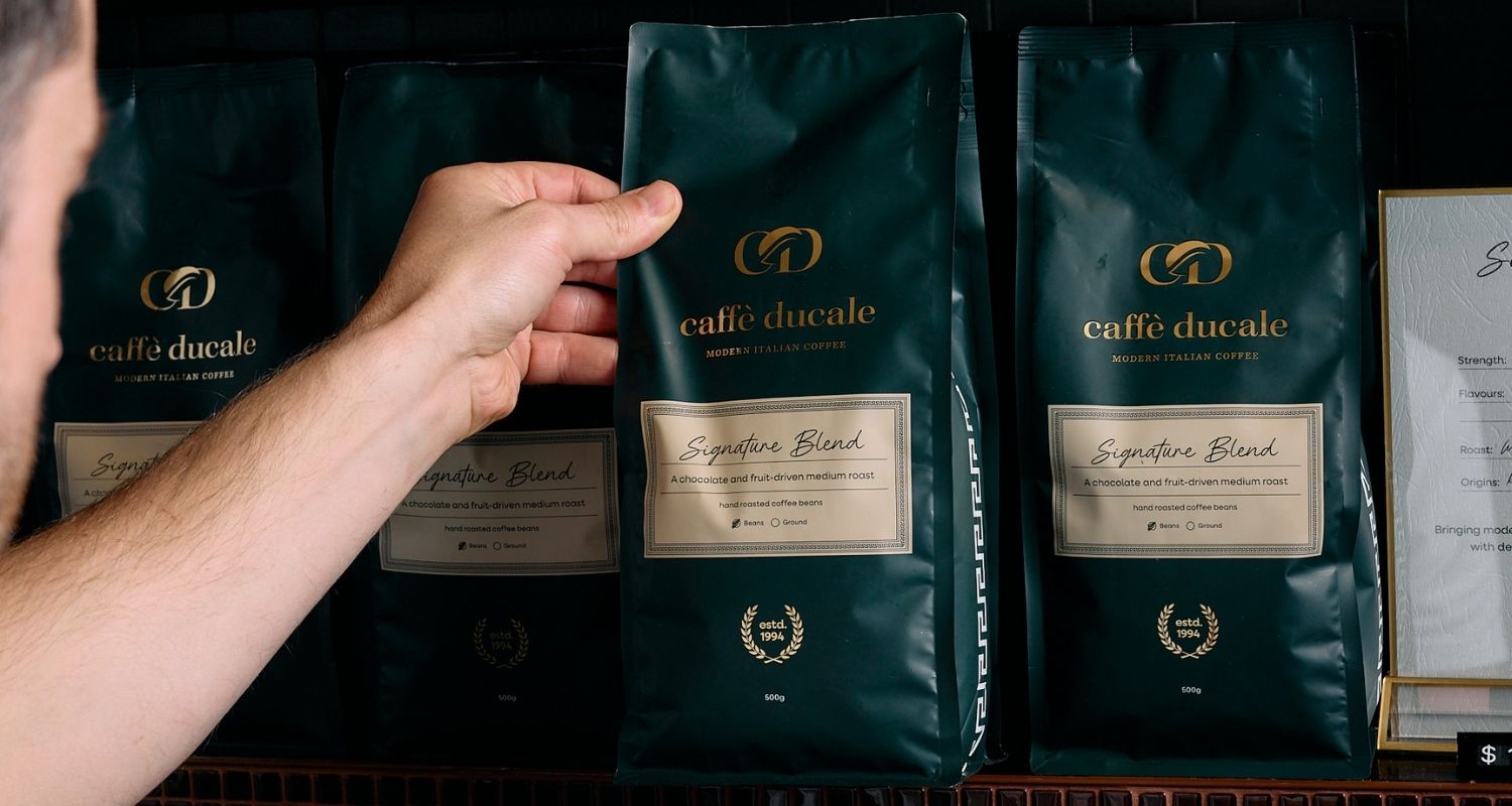 picking up coffee bag from shelf